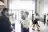 Group of business people standing and talking in office